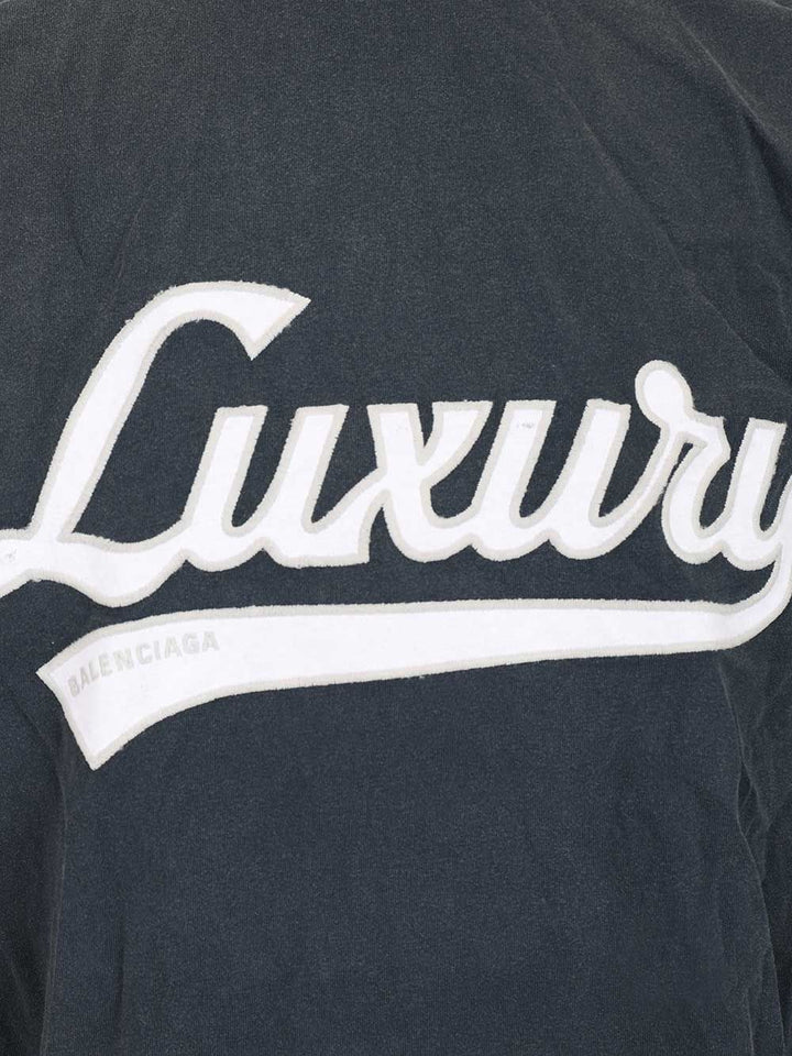 Balenciaga “Luxury Script Oversize” T-Shirt - Blu | ef96447bd1409bfbf50fcd5c856b723a720e6a63