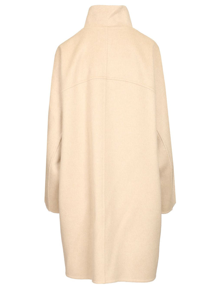 AlaÏA Asymmetrical Coat Knitwear - Beige | 3bd1b8d07f0e1d5ff60a31f55f4ba6c6cea90836