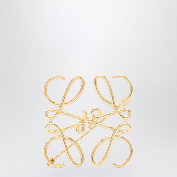 Broche con anagrama en metal dorado