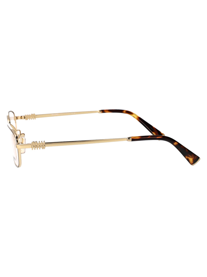 Miu Miu OPTICAL - Oro | b0559fa5b52ec623a9e89dddfd4df2d26ad83ec3
