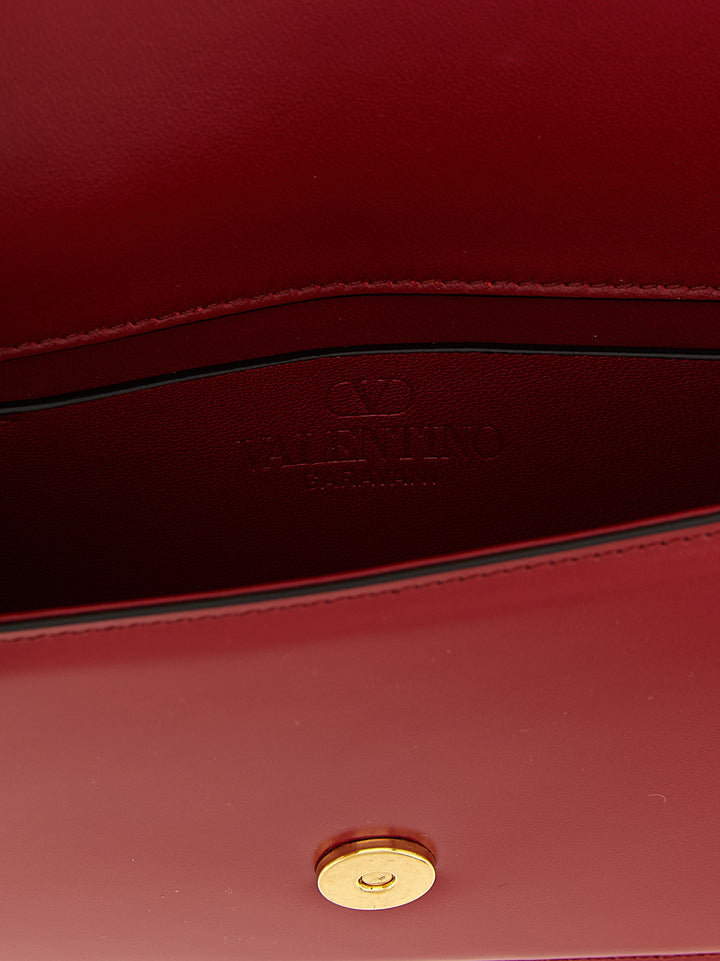 Valentino Garavani Vain Clutch - Rosso | a47b6d0c6778fb1ee07ce24271c10409ffa8be3b