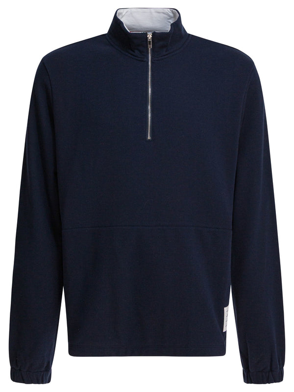 Sudaderas azules con media cremallera y logo