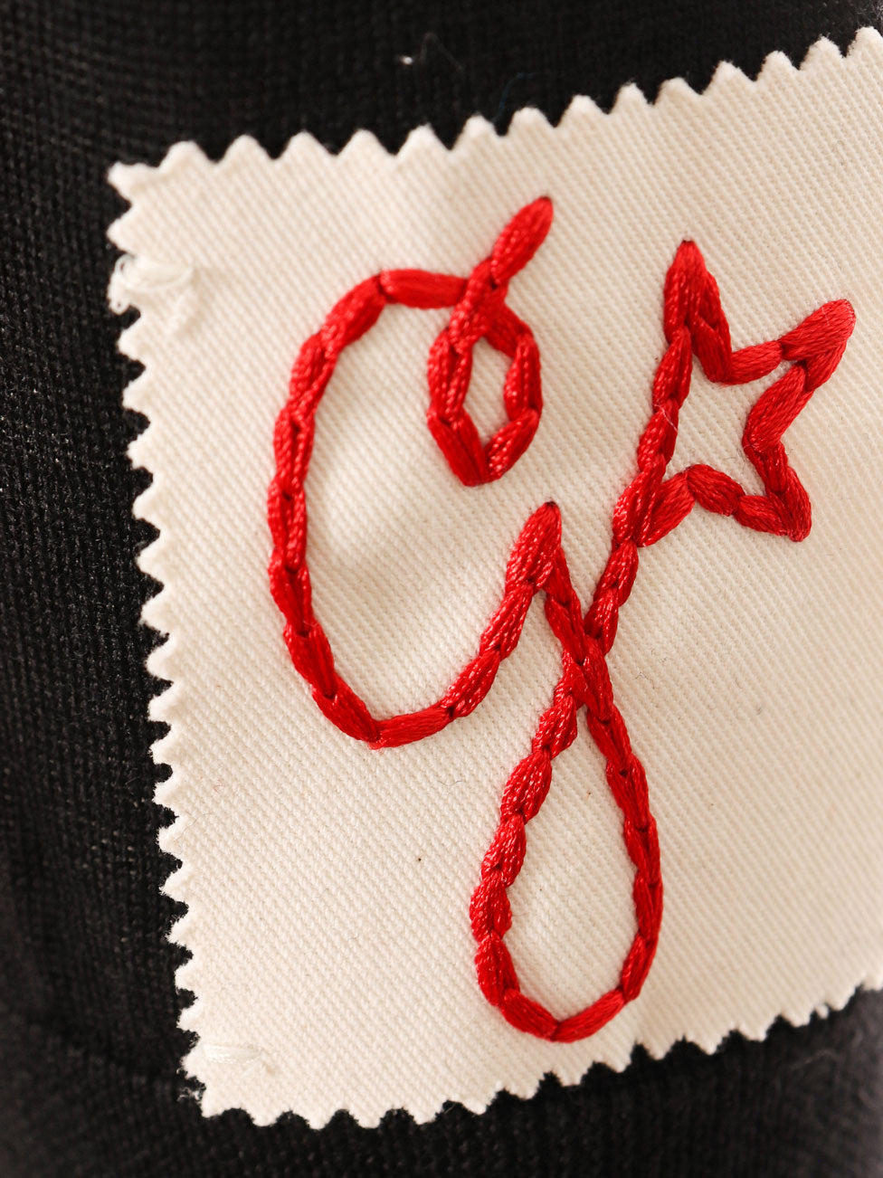 Maglia polo in lana vergine con monogramma ricamato