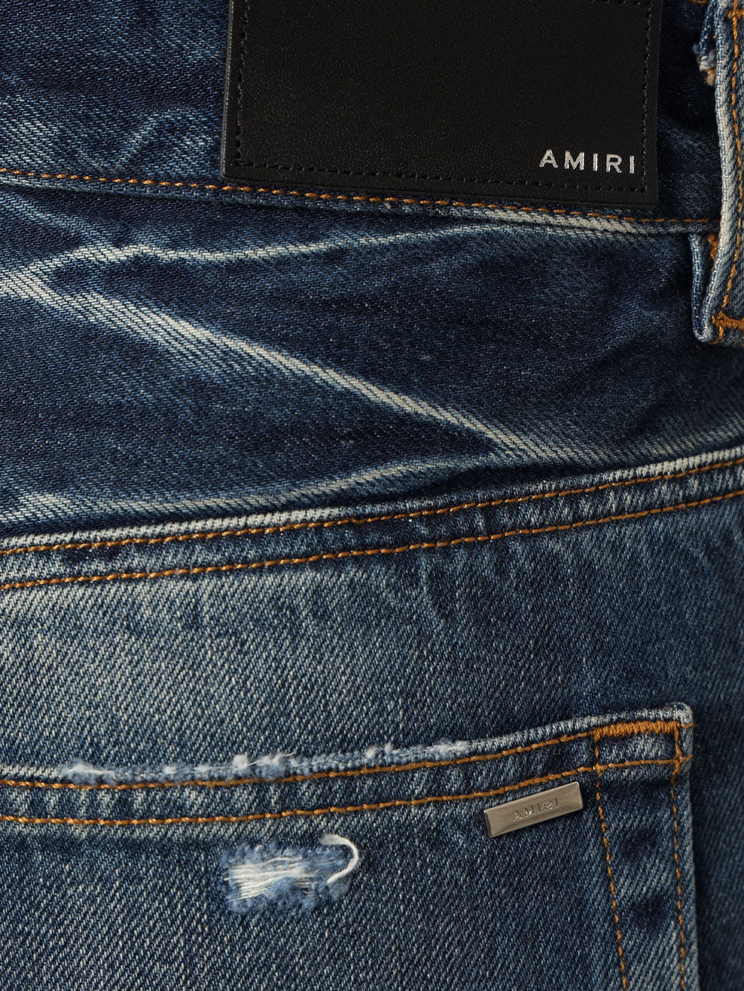 Jeans in cotone con effetto strappato