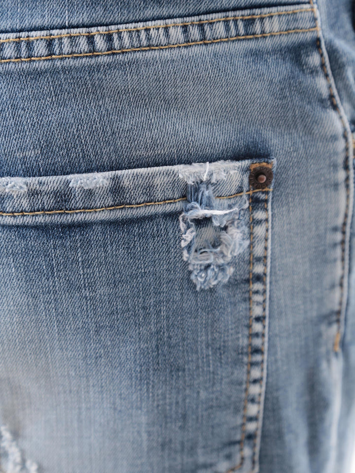 Jeans in cotone stretch con effetto strappato