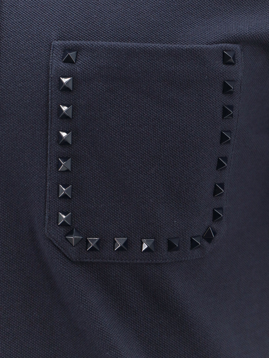 Maglia polo in cotone con iconiche borchie