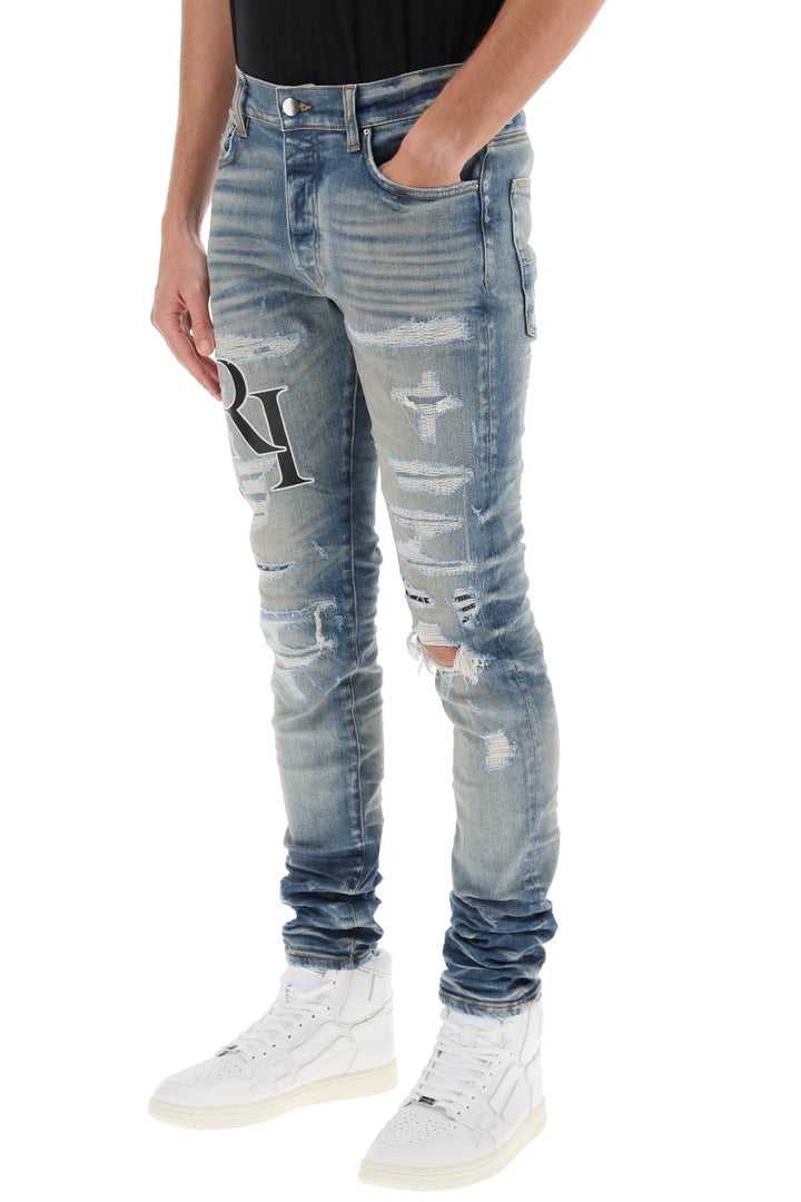 Jeans Destroyed Con Logo Sfalsato - Amiri - Uomo